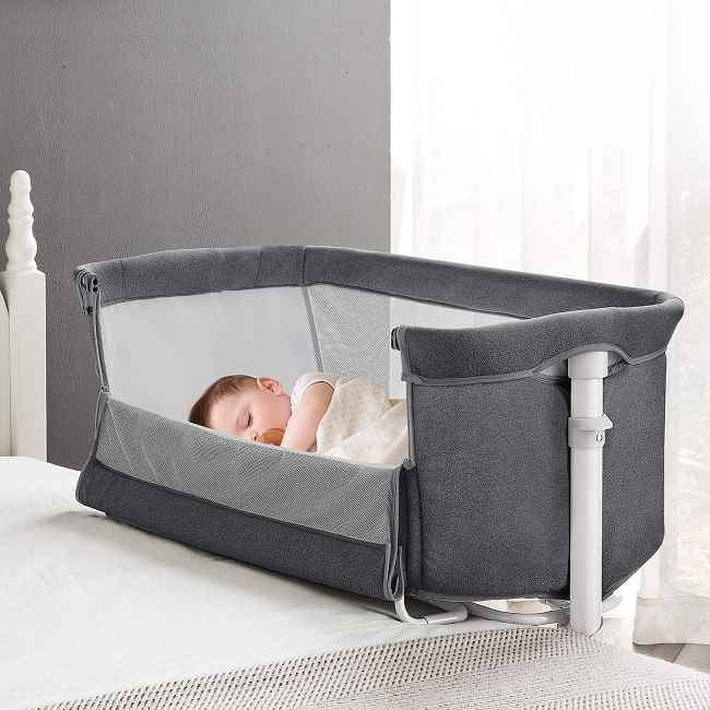 ​​Co-Sleeping Convenience:​​
Adjust this bedside crib to match your adult bed height (9 adjustable levels) for effortless nighttime feeding, comforting, and bonding.  Easily reach your baby without leaving your bed.

Secure & Stable Sleep:​​
A robust, rigid frame minimizes wobble, providing the steady foundation babies need for deeper, longer-lasting sleep.

Safety & Comfort Assured:​​
Built with certified, non-toxic materials and features a firm, supportive mattress wrapped in a soft, skin-friendly cover.

Seamless Parental Care:​​
The front side lowers for instant access, letting you comfort or attend to your baby quickly and maintain closeness while they rest securely in their own space.

Complete, Easy-Clean Setup:​​
Includes a quality mattress and a removable, washable cover for simple hygiene – ensuring a consistently clean, comfortable sleep environment.

Enduring Quality, Direct Value:​​
Benefit from factory-direct savings on a bedside crib built under strict quality-controlled processes by an experienced Chinese manufacturer known for durable infant products.